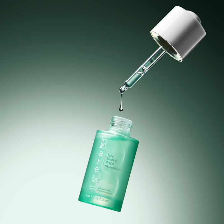 Green skincare serum bottle with dropper on a gradient background