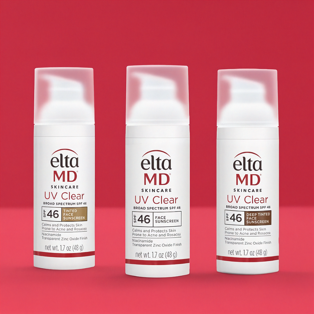 Three bottles of Elta MD UV Clear sunscreen on a red background