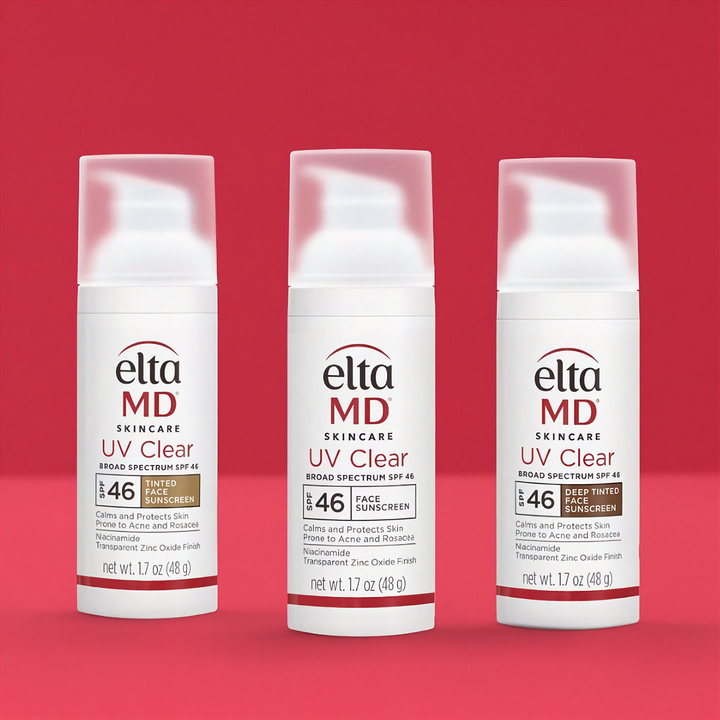 Three bottles of Elta MD UV Clear sunscreen on a red background