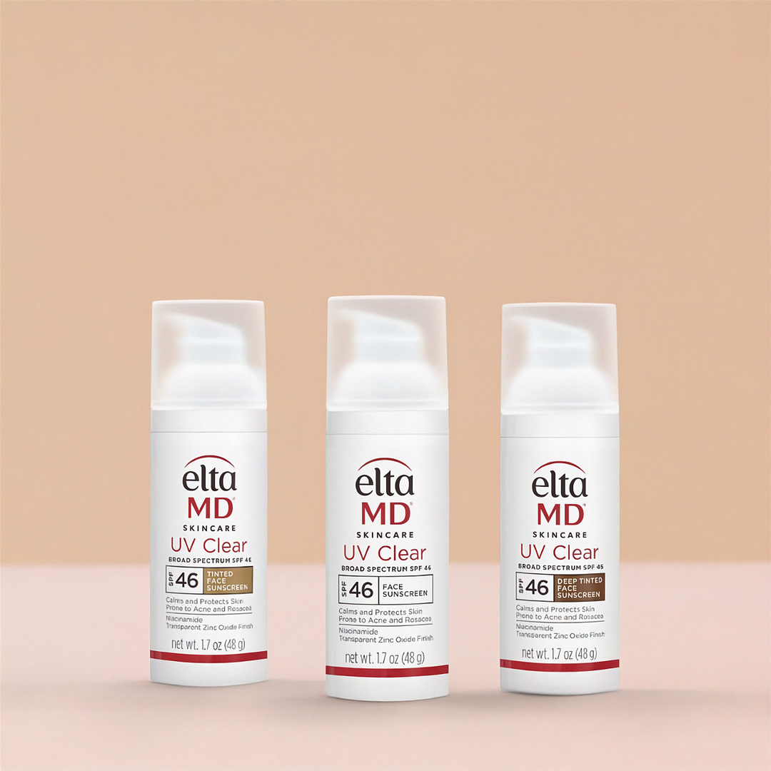 Three bottles of elta MD UV Clear skincare product on a beige background