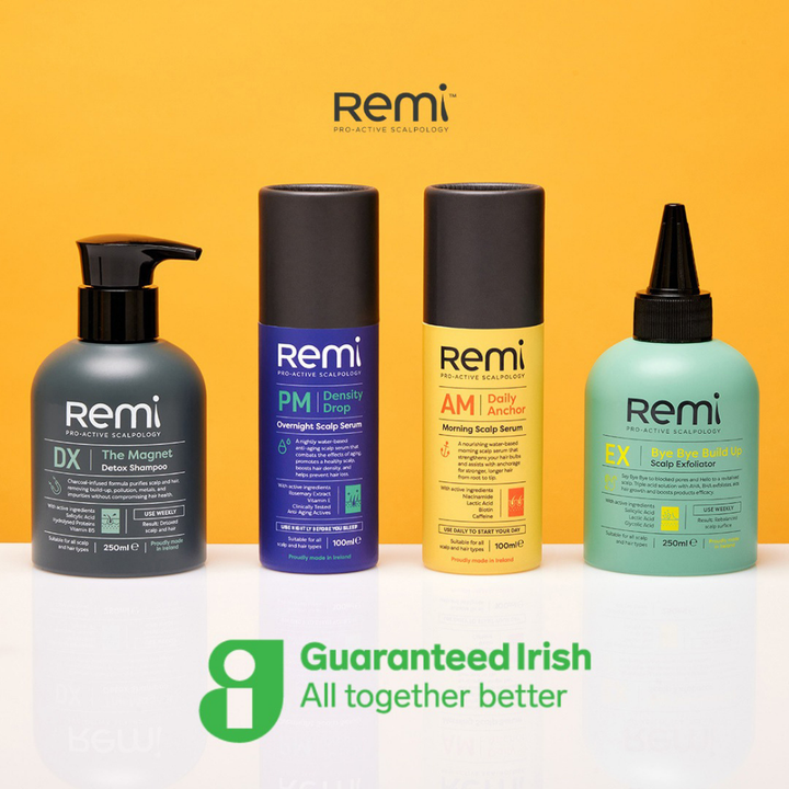Four Remi hair care products on a white surface with a yellow background