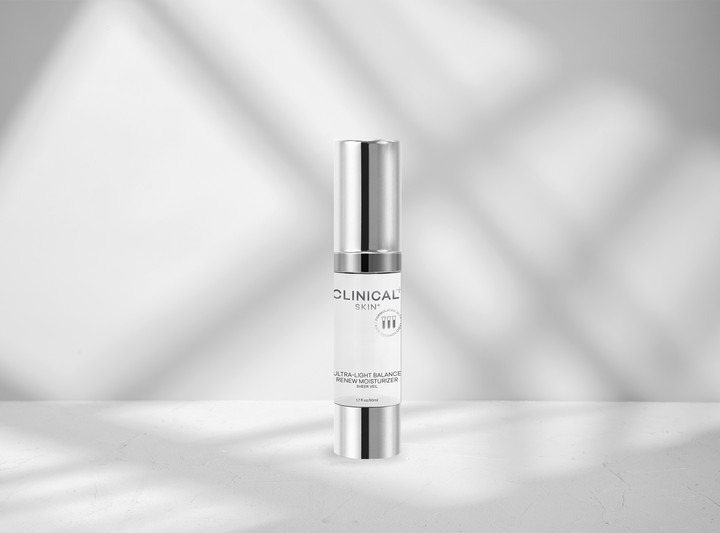 Skincare serum bottle with 'CLINICAL' branding on a silver background