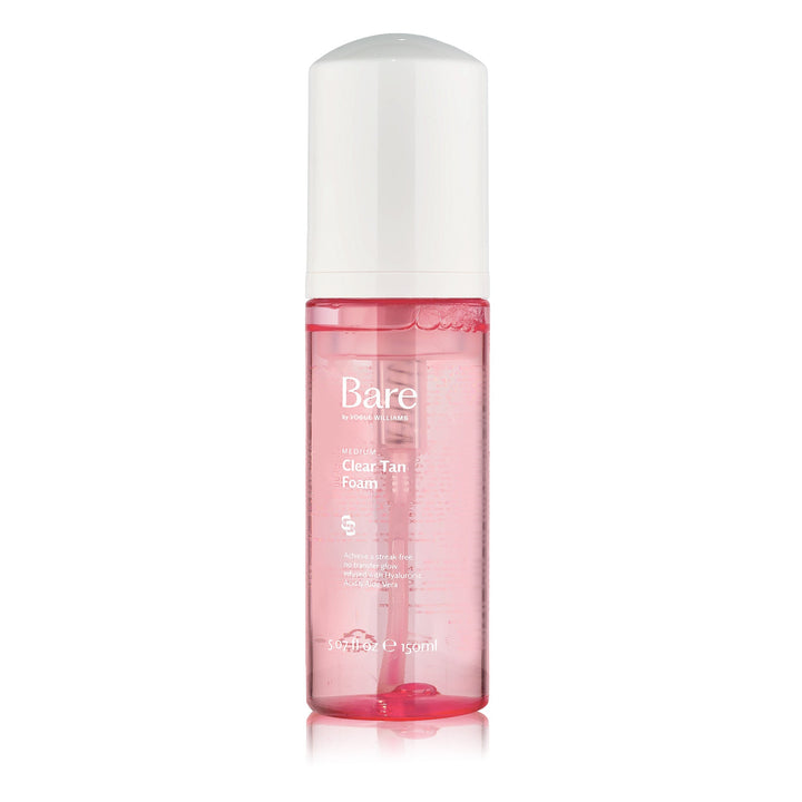 Bare by Vogue clear tan foam in a transparent pink bottle with a white cap and pump dispenser