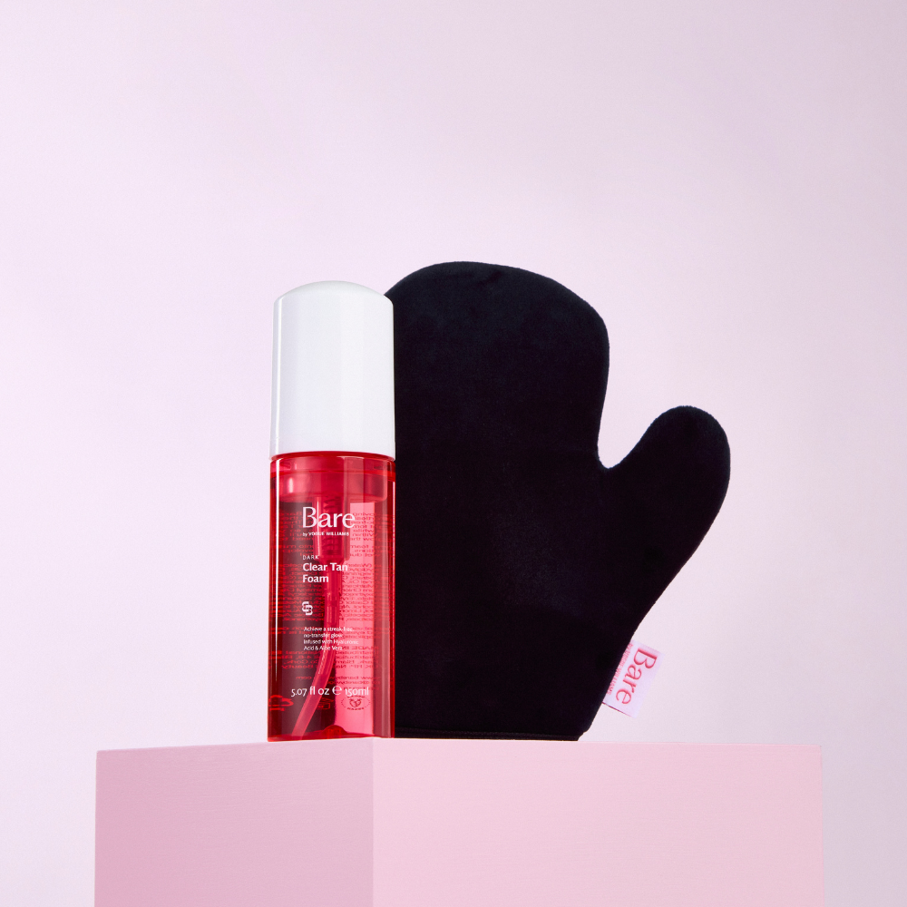 Bare by Vogue clear tan foam in a red pump bottle with white cap, paired with a black tanning mitt