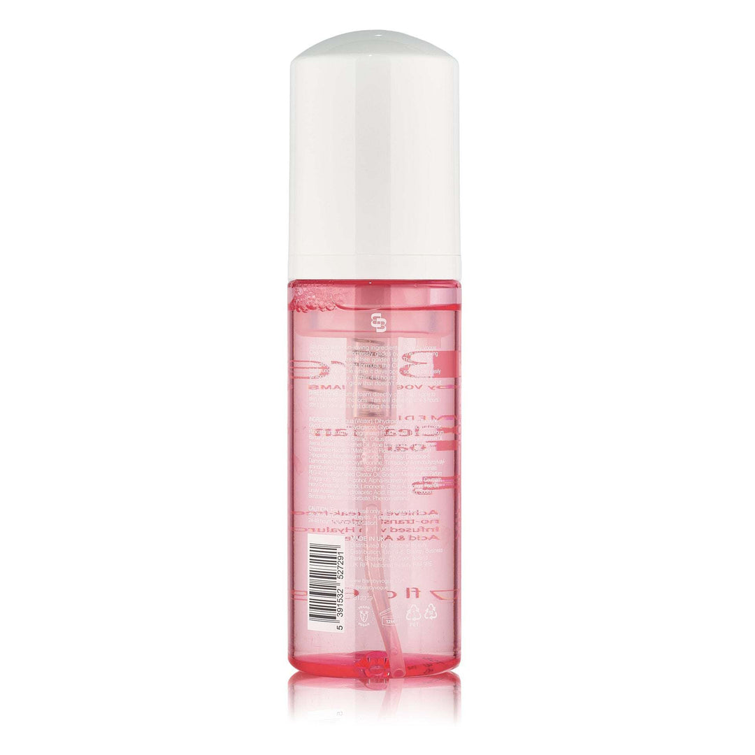 Bare by Vogue clear tanning foam in a transparent pink bottle with a white pump cap