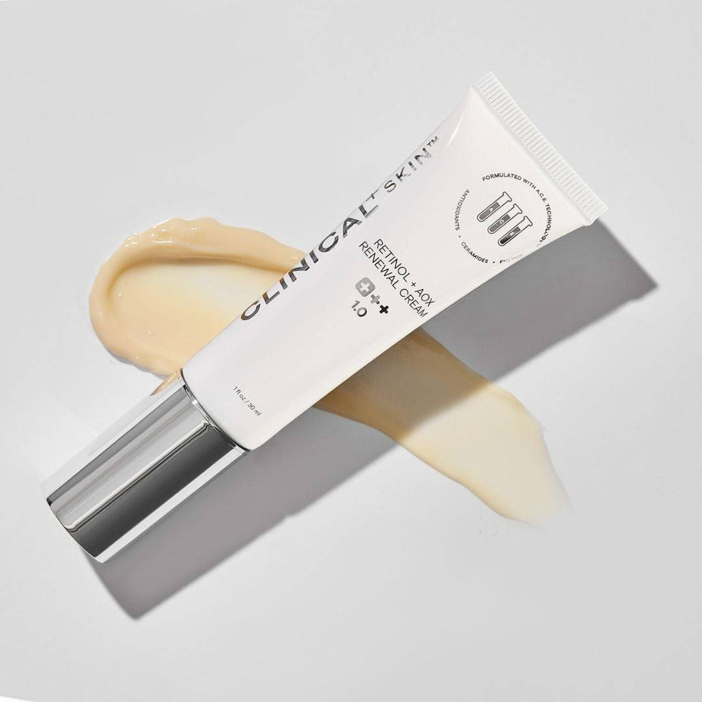 Clinical Skin Retinol cream in a white tube with chrome cap, shown with a creamy beige swatch