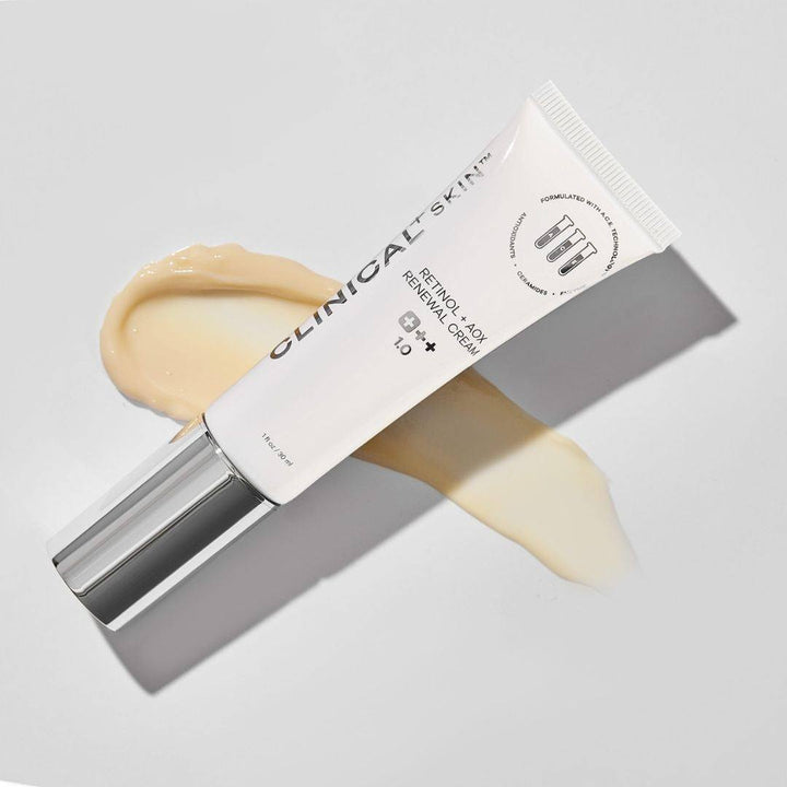 Clinical Skin Retinol cream in a white tube with chrome cap, shown with a creamy beige swatch
