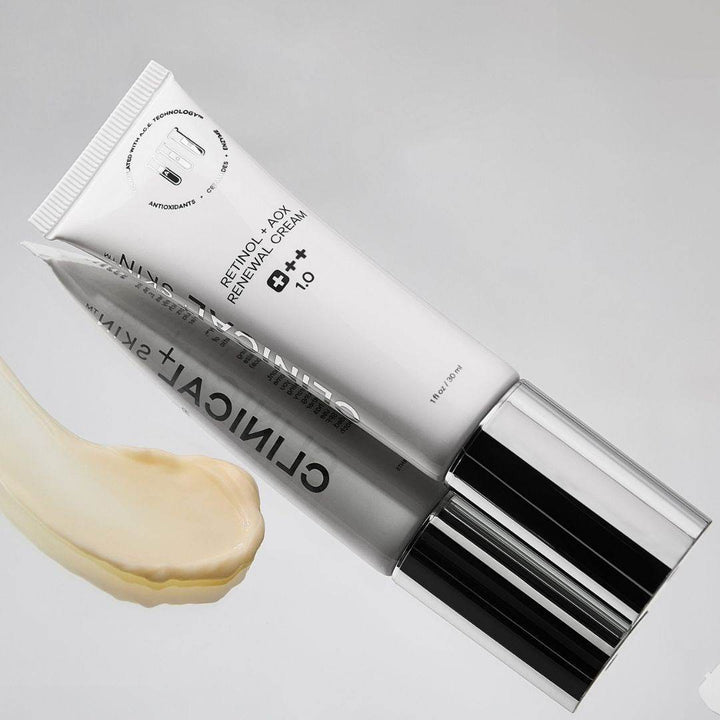 Clinical Skin Retinol renewal cream in a white tube with black and silver cap, shown with a cream swatch