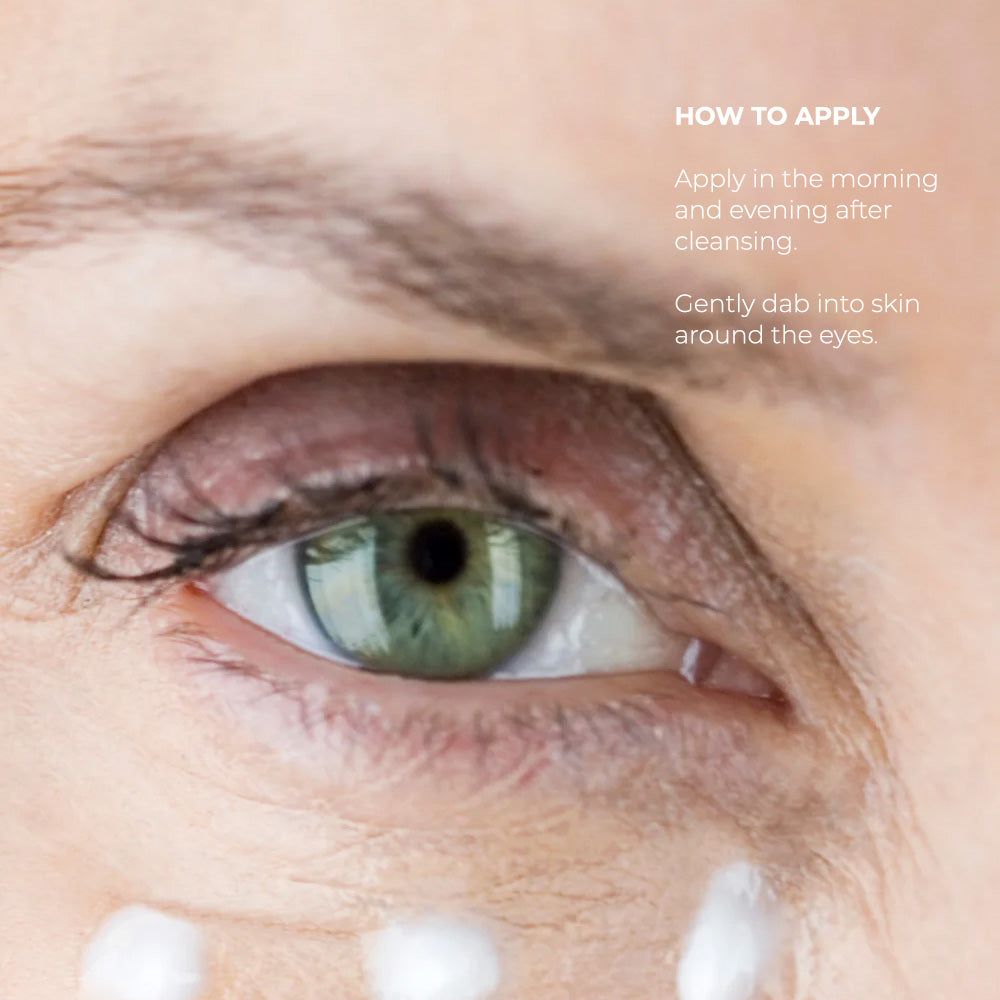 Clinical Skin Ultra-Rich Eye Cream applied beneath an eye, showing white cream dots and green iris