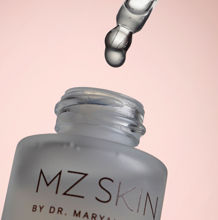 MZ Skin Bio-Placenta serum bottle with frosted glass, silver cap and dropper dispensing clear serum