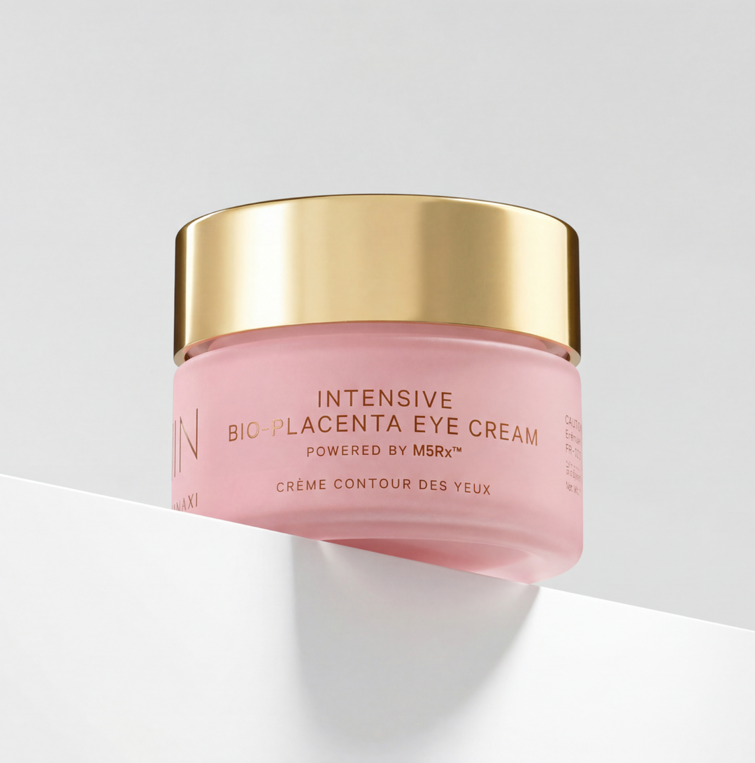 MZ Skin Intensive Bio-Placenta Eye Cream in a pink glass jar with a reflective gold lid and printed label
