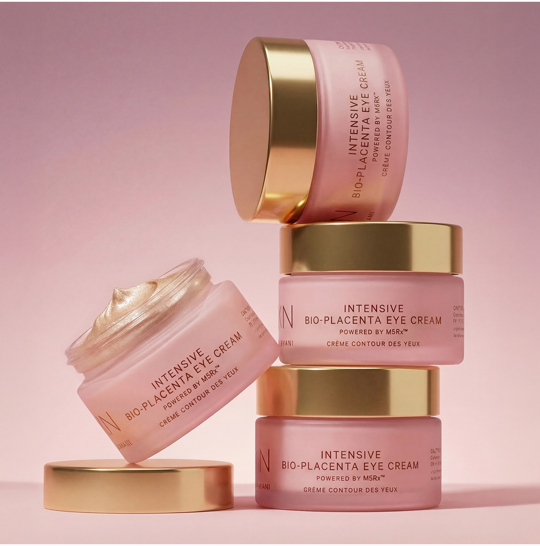 MZ Skin Intensive Bio-Placenta Eye Cream pink jars with gold lids, shown stacked and open with cream visible
