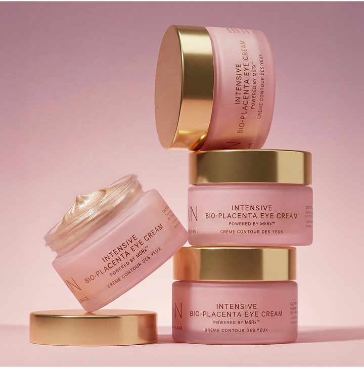 MZ Skin Intensive Bio-Placenta Eye Cream pink jars with gold lids, shown stacked and open with cream visible