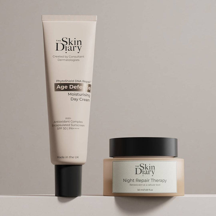Night Repair Therapy advanced anti-ageing night cream in beige jar with black lid next to beige tube of Age Defense moisturizing day cream with black cap