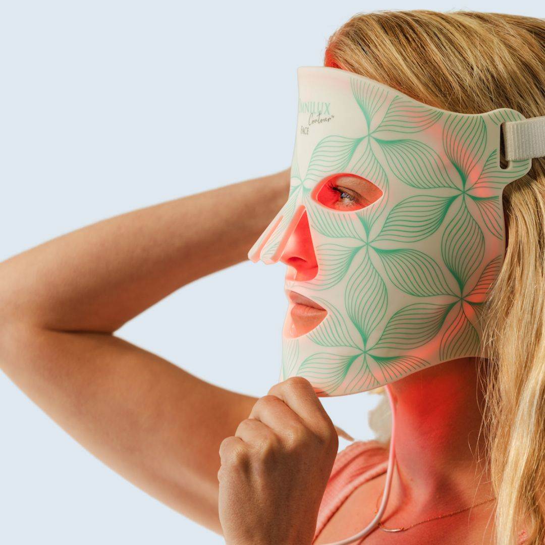 Omnilux Contour Face LED mask in pale green floral pattern, flexible silicone design with eye openings