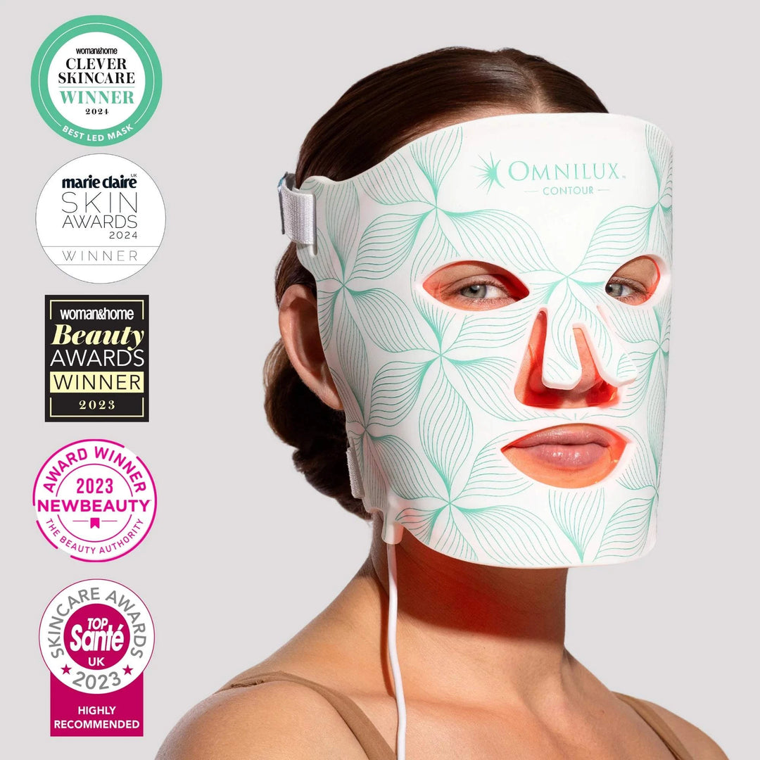 Omnilux Contour Face LED mask in white with teal leaf pattern, red light openings, and flexible design