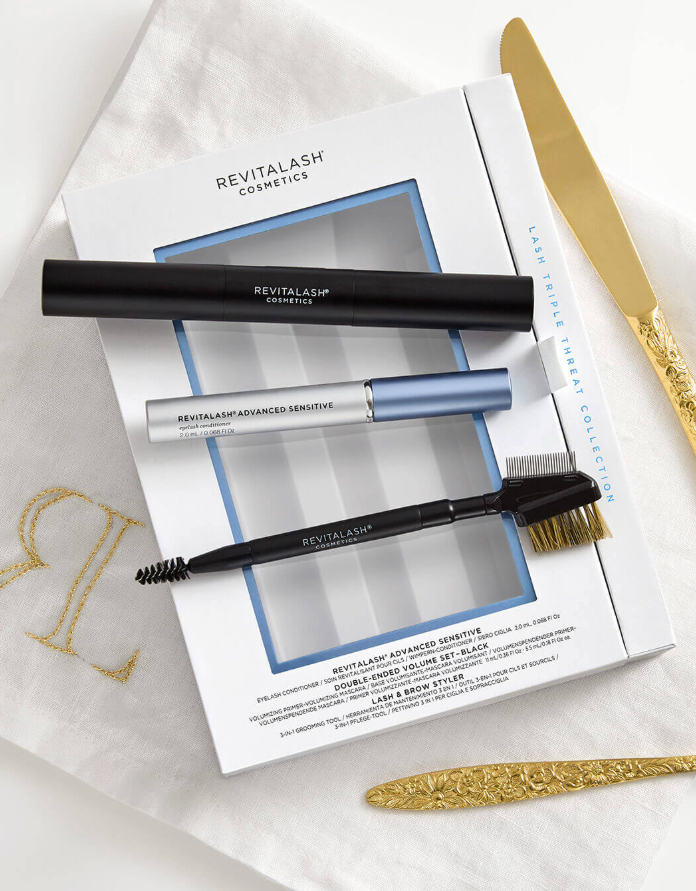 RevitaLash Triple Threat collection with black mascara, lash serum, brow styler and boxed packaging