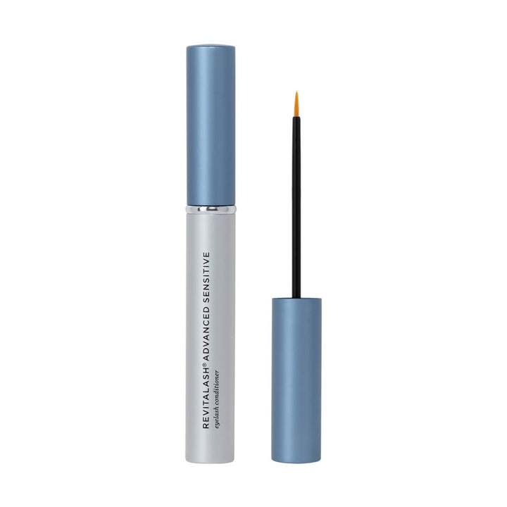 RevitaLash Triple Threat sensitive lash conditioner in a silver tube with blue cap and applicator wand