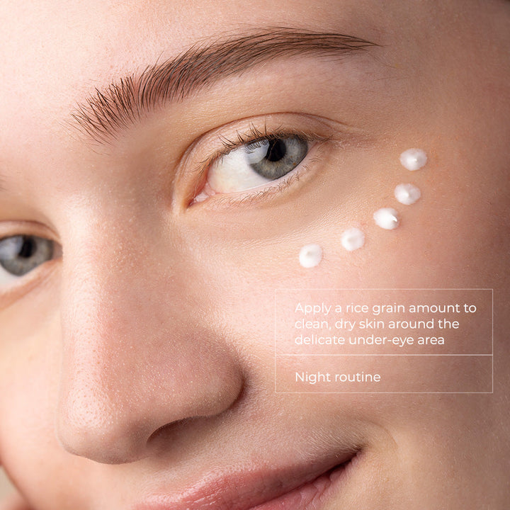 Skinbetter Science eye cream shown as white dots applied beneath the eye for a nightly under-eye skincare routine