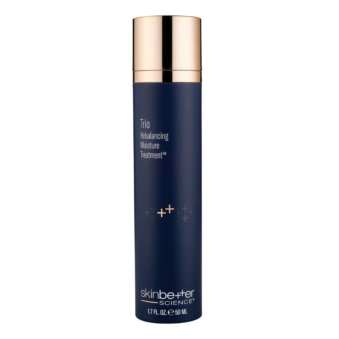 Skinbetter Science Trio Rebalancing Moisture Treatment in a navy blue cylindrical pump bottle with a rose gold cap