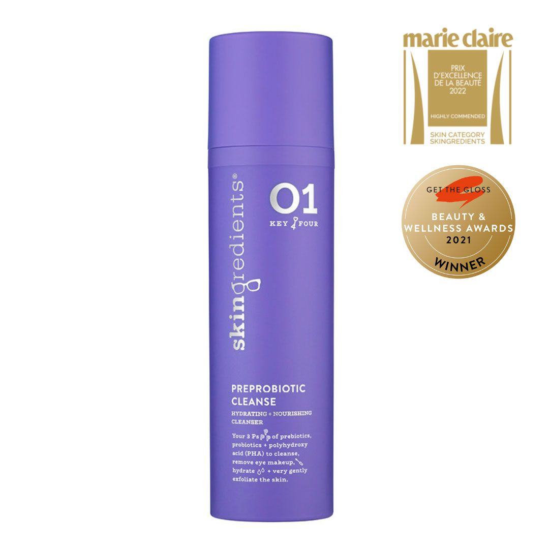 Skingredients PreProbiotic Cleanser in a purple cylindrical pump bottle with white lettering and award badges