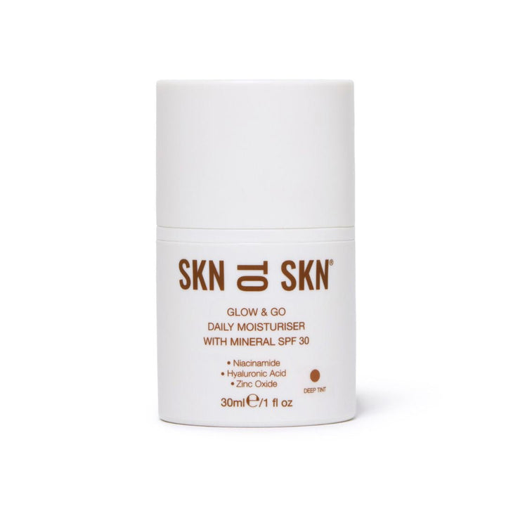 Skn to Skn Glow & Go daily moisturiser in a white cylindrical pump bottle with deep tint and mineral SPF 30