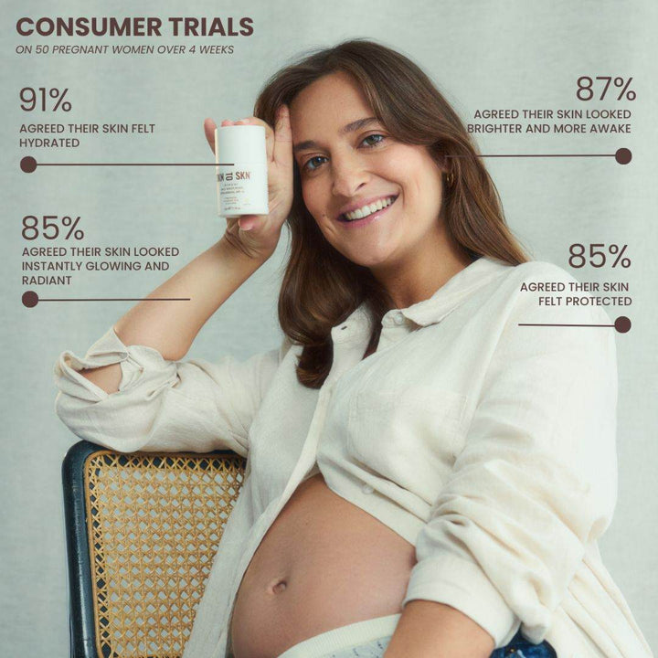 Skn to Skn Glow & Go tinted moisturiser in a white pump bottle held by a pregnant woman