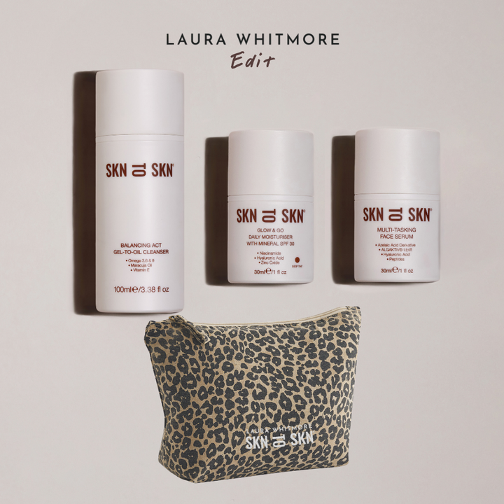 Skn to Skn Laura Whitmore skincare gift set with white bottles of cleanser, moisturizer with SPF 30, serum, and leopard print pouch
