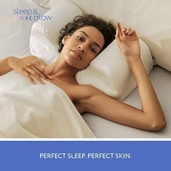 Sleep and Glow white ergonomic pillow supporting a woman sleeping on her back with raised side bolsters